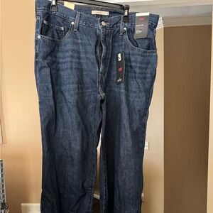 Levis straight-leg jeans in a medium blue wash.
